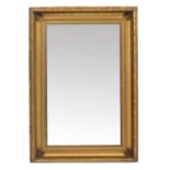 A RECTANGULAR WALL MIRROR with moulded gilt gesso frame around the plain mirror plate, 117cm x 81cm