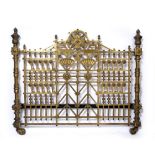 A VICTORIAN BRASS BEDSTEAD in the aesthetic style, decorated with styalised floral roundels and