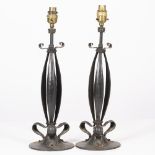 A PAIR OF EARLY 20TH CENTURY ART NOUVEAU BLACK PAINTED WROUGHT IRON TABLE LAMPS with styalised