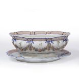 AN ITALIAN TIN GLAZED POTTERY OVAL TUREEN AND STAND decorated with floral swags, marked beneath