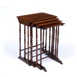A WILLIAM IV NEST OF ROSEWOOD OCCASIONAL TABLES with plain rectangular tops, turned legs and