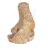 A FRAGMENT OF ANCIENT MARBLE SCULPTURE depicting the lower part of a dress and one foot, 19cm