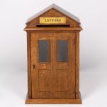 AN OAK COUNTRY HOUSE TYPE POSTING BOX with engraved brass 'letters' plate over the posting slot