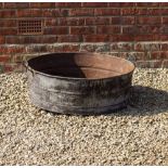 A CIRCULAR TIN BATH with looping handles, 80cm diameter x 27cm high to the rim