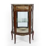 A 19TH CENTURY WALNUT BIJOUTERIE DISPLAY CABINET with serpentine front and ormolu mounts, 66.5cm