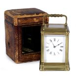 A FRENCH BRASS CARRIAGE CLOCK with gorge case, plain enamel dial with roman numerals with movement