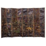 A LARGE COUNTRY HOUSE LEATHER MOUNTED EIGHT FOLD SCREEN with Oriental scenes depicting figures