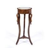 AN EMPIRE STYLE JARDINIERE STAND OR TORCHIERE with marble inset drum top, swans head tops to the