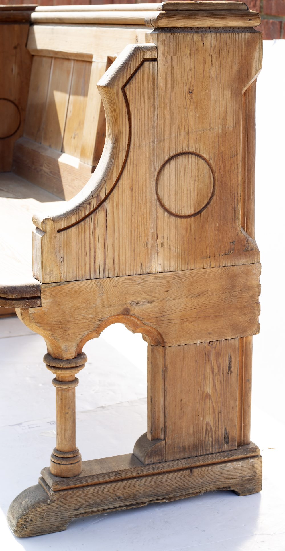 A VICTORIAN PINE FOUR SEATER PEW with moulded top rail, shaped ends and turned supports to the seat, - Image 3 of 4