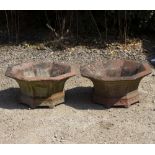 A PAIR OF SHALLOW CAST TERRACOTTA OCTAGONAL URNS OR PLANTERS, 57cm diameter x 27cm high (some