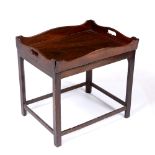 A MAHOGANY GALLERIED BUTLERS TRAY with pierced carrying handles to the side and hinged front, all on