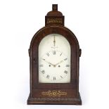 A WILLIAM IV ROSEWOOD TABLE CLOCK the arching case surmounted by a stepped pediment with brass