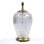 A WATERFORD CUT GLASS AND BRASS MOUNTED TABLE LAMP of inverted baluster form, 22cm diameter x 47cm