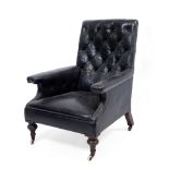 A VICTORIAN LEATHER UPHOLSTERED DEEP ARMCHAIR with button back, turned front legs and ceramic