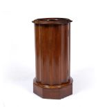 A VICTORIAN MAHOGANY BASIN STAND OR POT CUPBOARD of fluted column form with ring turned top and