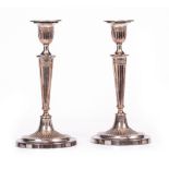 A PAIR OF OLD SHEFFIELD PLATE ADAMS STYLE CANDLESTICKS of oval form with drip pans, fluted stems,