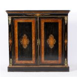 A VICTORIAN EBONISED AND INLAID TWO DOOR CABINET with brass mounts, the doors opening to reveal a