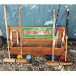 A JOHN JACQUES AND SON CROQUET SET with four mallets (differences), hoops, balls etc in a pine