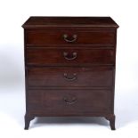 A GEORGE III MAHOGANY SIMULATED CHEST COMMODE with four faux drawers to the front, the lifting lid