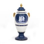 A PORCELAIN VASE AND COVER in the neo-classical style with gilt finial and ram's masks and with '