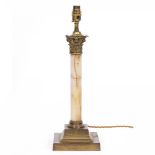 A BRASS AND ONYX TABLE LAMP of Corinthian column form with cast capital and stepped base, 15cm