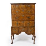 AN EARLY GEORGE III WALNUT CHEST ON STAND the upper section with two short over three long