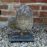 AN ANTIQUE CARVED LIMESTONE SCULPTURE depicting a head of a woman and child, 27cm wide x 24cm