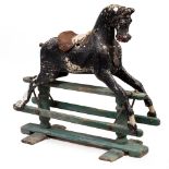 A LATE 19TH / EARLY 20TH CENTURY PAINTED AND CARVED WOODEN ROCKING HORSE overall 100cm wide x 39cm