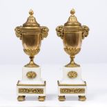 A PAIR OF 19TH CENTURY ORMOLU AND WHITE MARBLE CANDLE VASES of classical form with reversible