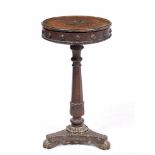 AN UNUSUAL 19TH CENTURY CIRCULAR OAK POP UP WORK TABLE with an octagonal tapering stem, a triform