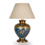 A GILDED AND BLUE GROUND PLASTER LAMP of baluster vase form, with flower decoration, 68cm in