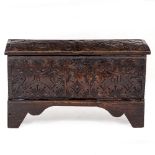 A SMALL SIZE ANTIQUE OAK COFFER with later chip carve decoration, 80cm wide x 30cm deep x 45cm high