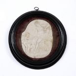 AN ANTIQUE CARVED MARBLE FRAGMENT depicting Venus and Cupid set in a turned ebonised frame, the
