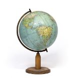 A MID 20TH CENTURY TERRESTRIAL GLOBE on a turned wooden stand with inset compass, the globe 33cm