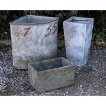 A GALVANIZED CORNER GRAIN TUB bearing the number 1759, together with two further composite plants,