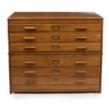 AN EARLY TO MID 20TH CENTURY OAK PLAN CHEST with six long drawers, 113cm wide x 83cm deep x 92cm