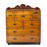A LATE 19TH CENTURY CAMPHOR WOOD CAMPAIGN SECRETAIRE CHEST with decorative brass inlay, carved