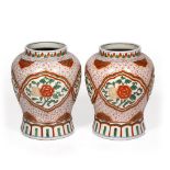 A PAIR OF ORIENTAL PORCELAIN BALUSTER VASES with flower decoration, 26cm diameter x 36cm high (2)