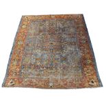 AN ANTIQUE ZEIGLER BLUE GROUND CARPET with floral decoration to the central field within a banded