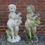 TWO COMPOSITE STONE CHERUBS each 80cm in height