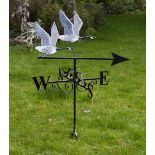 A WROUGHT IRON WEATHER VANE surmounted by two flying Canada geese, the weather vane displaying the