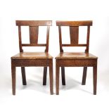 A PAIR OF 19TH CENTURY OAK BAR BACK COUNTRY CHAIRS with solid vertical splats, carved seats and