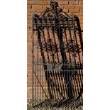 A PAIR OF 19TH CENTURY BLACK PAINTED WROUGHT IRON GARDEN GATES the lock plate signed Reynolds