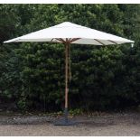 A LARGE PARASOL with cream coloured canvas covering, wooden pole and grey painted stand (2)