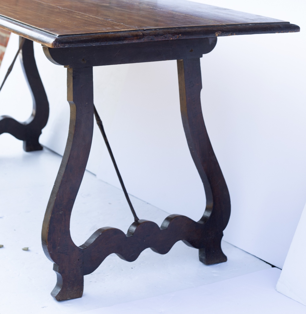 AN ANTIQUE SPANISH CHESTNUT RECTANGULAR TOPPED TRESTLE TABLE with shaped hinged end supports and - Image 3 of 4