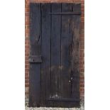 17TH OR 18TH CENTURY BLACK PAINTED OAK COTTAGE DOOR with old lock and strapwork hinges, 95cm wide