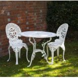 A WHITE PAINTED GARDEN TABLE 80cm diameter with a pair of white painted garden chairs, 86cm high