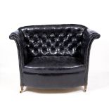A BLACK LEATHER UPHOLSTERED HIGH BACKED WINDOW SEAT OR SOFA with bowed front, scroll arms and square
