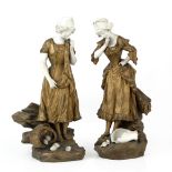 JULIEN CAUSSE (1869-1909) Two gilt Spelter and porcelain sculptures depicting young girls with