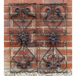 A PAIR OF RECTANGULAR WROUGHT IRON PANELS with spiraling decoration, 30cm wide x 75cm high (2)